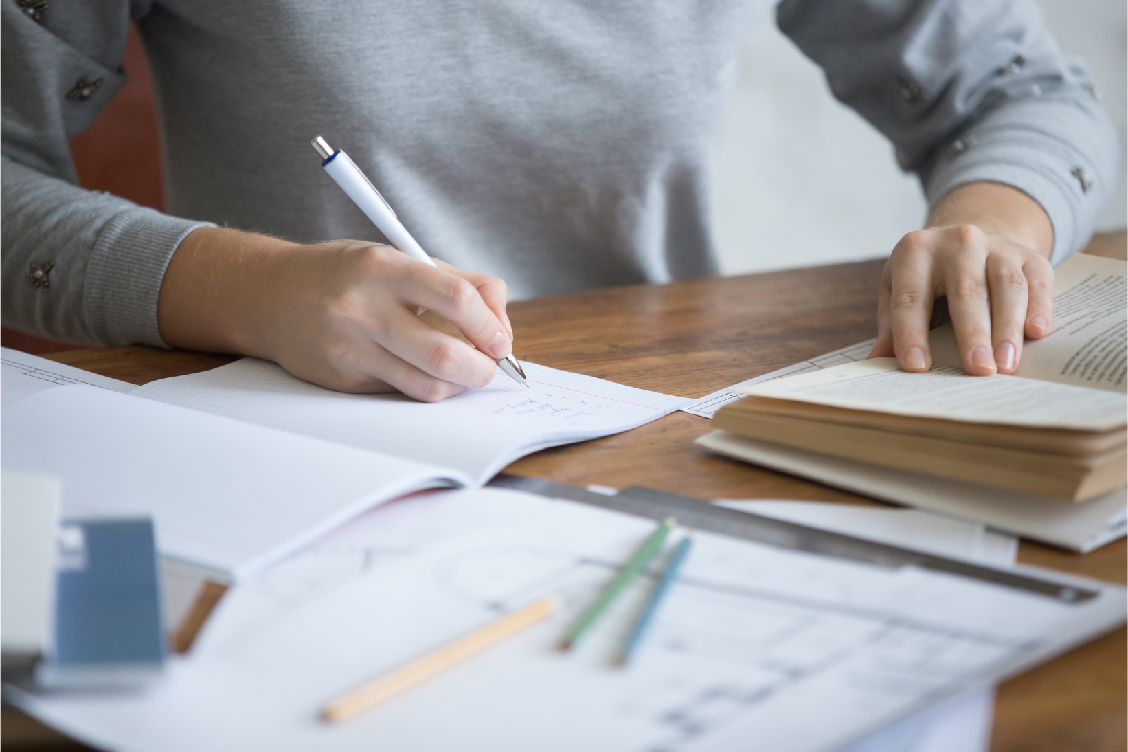 student-female-hands-performing-written-task-copybook